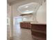 Finished basement showcasing custom bar with sink and wood cabinets plus recessed ceiling lights at 404 Joseph Way, Carmel, IN 46032