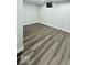 Finished room in basement with light gray walls and light gray wood-look flooring at 404 Joseph Way, Carmel, IN 46032