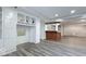Spacious basement with custom built-ins, recessed lights, wood-look floors and a bar area at 404 Joseph Way, Carmel, IN 46032