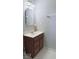 A bathroom vanity with a decorative mirror and updated lighting at 404 Joseph Way, Carmel, IN 46032