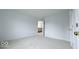 A bedroom with light walls and carpet, and view to the staircase at 404 Joseph Way, Carmel, IN 46032