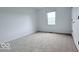 A cozy bedroom featuring neutral carpet, light walls and natural light at 404 Joseph Way, Carmel, IN 46032