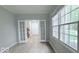 Living space with white french doors to another room and bright windows with views at 404 Joseph Way, Carmel, IN 46032