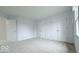 Spacious bedroom showcasing neutral carpet, two closets and ample natural light at 404 Joseph Way, Carmel, IN 46032