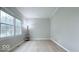 Bright bedroom with neutral paint and LVP flooring, and views from a large window at 404 Joseph Way, Carmel, IN 46032