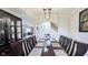 Formal dining room with an archway leading to the living room and stairs at 404 Joseph Way, Carmel, IN 46032