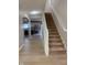 Bright entryway boasts hardwood floors and a staircase leading upstairs to the bedrooms at 404 Joseph Way, Carmel, IN 46032