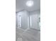 Light and bright foyer with light gray walls and LVP flooring throughout the home at 404 Joseph Way, Carmel, IN 46032