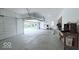 View of garage with open door looking out onto lush, green yard at 404 Joseph Way, Carmel, IN 46032