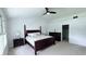 Bright main bedroom with a ceiling fan, cozy carpet flooring, and adjacent walk-in closet at 404 Joseph Way, Carmel, IN 46032