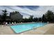 Community pool with lounge chairs and nearby shade trees at 404 Joseph Way, Carmel, IN 46032