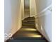 The home features a carpeted staircase and decorative lighting at 404 Joseph Way, Carmel, IN 46032