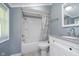 Bathroom featuring a tub/shower combo and white vanity with granite top at 4325 Norwaldo Ave, Indianapolis, IN 46205