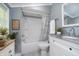 Well-lit bathroom with a shower-tub combo, modern vanity, and stylish decorative accents at 4325 Norwaldo Ave, Indianapolis, IN 46205