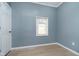 Bedroom features wood flooring, a window with blinds, and neutral paint at 4325 Norwaldo Ave, Indianapolis, IN 46205