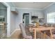 Dining room featuring a wooden table with seating for six, light gray walls, and modern decor at 4325 Norwaldo Ave, Indianapolis, IN 46205