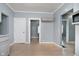 Spacious kitchen area showcasing wood floors, gray walls and cabinets, with doorways at 4325 Norwaldo Ave, Indianapolis, IN 46205