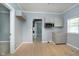Bright kitchen features gray cabinets, wood floors, and stainless steel microwave at 4325 Norwaldo Ave, Indianapolis, IN 46205