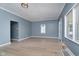 Bright Living room featuring wood flooring, two windows for natural light, and light blue walls at 4325 Norwaldo Ave, Indianapolis, IN 46205