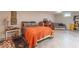 Basement bedroom featuring tiled floors, a comfortable bed, and a dedicated workout area with a treadmill at 445 N 13Th Ave, Beech Grove, IN 46107