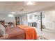 Spacious basement bedroom featuring a cozy bed, workspace, and ample storage with built-in shelving and a closet at 445 N 13Th Ave, Beech Grove, IN 46107