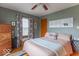 Charming bedroom with calming colors, a cozy bed, and hardwood floors at 445 N 13Th Ave, Beech Grove, IN 46107