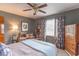 Calm bedroom featuring a wooden dresser, neutral colors, and a plush bed at 445 N 13Th Ave, Beech Grove, IN 46107