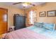 Comfortable bedroom with floral curtains, a ceiling fan and neutral wall paint at 445 N 13Th Ave, Beech Grove, IN 46107