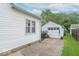 Exterior of a home featuring a detached garage, well-maintained siding, and a green lawn at 445 N 13Th Ave, Beech Grove, IN 46107