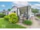 Charming home featuring a well-manicured front yard, a covered porch, and a long driveway at 445 N 13Th Ave, Beech Grove, IN 46107