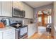 Modern kitchen with stainless steel appliances and elegant countertops at 445 N 13Th Ave, Beech Grove, IN 46107