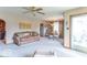 Cozy living room featuring leather sofa, ceiling fan, and seamless access to dining area at 445 N 13Th Ave, Beech Grove, IN 46107
