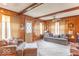 Inviting living room featuring wood paneled walls and a comfortable seating area at 445 N 13Th Ave, Beech Grove, IN 46107
