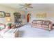 Comfortable living room with plush seating and natural light from the ceiling fan at 445 N 13Th Ave, Beech Grove, IN 46107