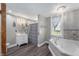 Bright bathroom features a soaking tub, a stylish vanity, and modern finishes at 5312 E Southern Ave, Indianapolis, IN 46203