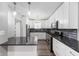 Stylish kitchen with granite countertops, white cabinetry, and stainless steel appliances at 5312 E Southern Ave, Indianapolis, IN 46203