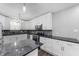 Modern kitchen with white cabinets, granite countertops, and stainless steel appliances at 5312 E Southern Ave, Indianapolis, IN 46203