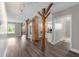Inviting living room with hardwood floors, brick columns, and an open layout perfect for entertaining at 5312 E Southern Ave, Indianapolis, IN 46203