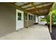 A spacious back porch featuring a metal roof and access to the house at 5422 Orange St, Indianapolis, IN 46203