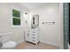 Bathroom featuring white cabinets, granite countertops and an updated mirror and fixtures at 5422 Orange St, Indianapolis, IN 46203