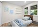 Bright bedroom with a cozy bed, soft rug, and artwork, creating a serene and inviting space at 5422 Orange St, Indianapolis, IN 46203
