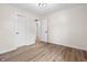 Spacious room showcasing updated flooring, modern lighting fixture and ample closet space at 5422 Orange St, Indianapolis, IN 46203