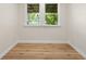 Empty bonus room showcasing natural light and updated flooring creating a versatile space at 5422 Orange St, Indianapolis, IN 46203
