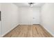 Bright room featuring updated flooring, modern lighting fixture, and ample space at 5422 Orange St, Indianapolis, IN 46203