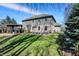 Expansive backyard showing patio, pergola, and manicured lawn at 545 Walnut Woods Dr, Greenwood, IN 46142