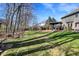 View of home's backyard with patio and landscaped lawn area at 545 Walnut Woods Dr, Greenwood, IN 46142