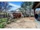 Backyard patio view with custom metal art feature and landscaping at 545 Walnut Woods Dr, Greenwood, IN 46142