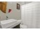 Modern bathroom featuring a vessel sink, stylish mirror, and a shower with a patterned curtain at 545 Walnut Woods Dr, Greenwood, IN 46142
