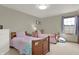 Bedroom featuring two twin beds, dresser, and natural light at 545 Walnut Woods Dr, Greenwood, IN 46142