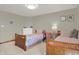 Bedroom showcasing twin beds, dresser, and comfortable layout at 545 Walnut Woods Dr, Greenwood, IN 46142